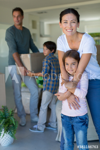 Portrait happy family moving into new house