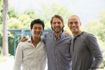 Portrait happy male friends on patio