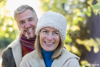 Portrait happy mature couple in park