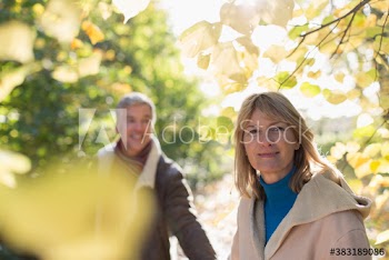 Portrait happy mature couple in park