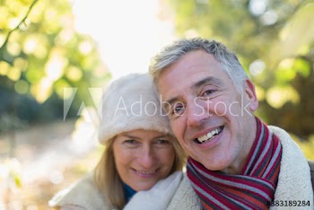 Portrait happy mature couple in park