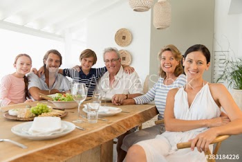 Portrait happy multi-generation family enjoying lunch at table