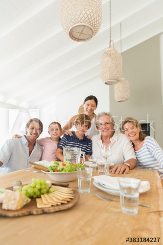 Portrait happy multi-generation family enjoying lunch at table