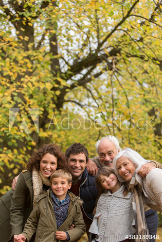 Portrait happy multi-generation family in autumn park