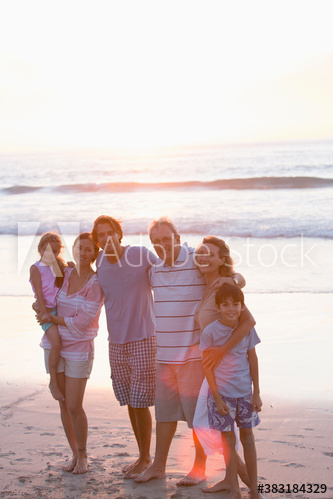 Portrait happy multi-generation family on beach