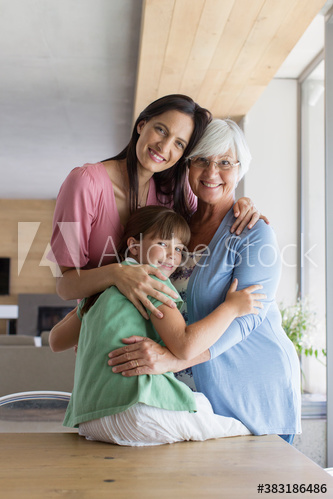 Portrait happy multi-generation women hugging