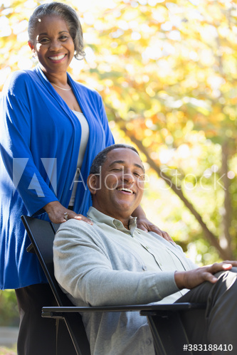 Portrait happy senior couple on autumn patio