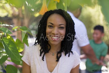 Portrait happy woman in backyard
