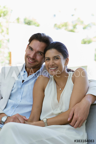Portrait happy young couple hugging