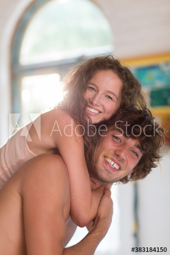 Portrait happy young couple hugging
