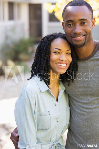 Portrait happy young couple on patio