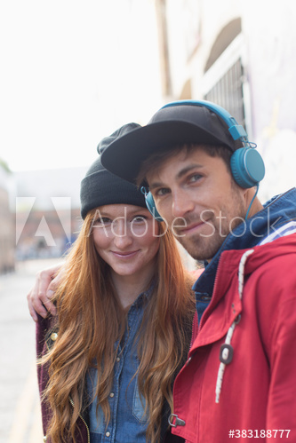 Portrait happy young man and woman on street