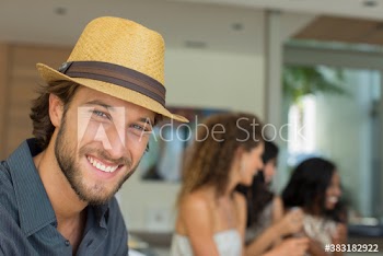Portrait happy young man in hat