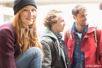 Portrait happy young woman hanging out with friends