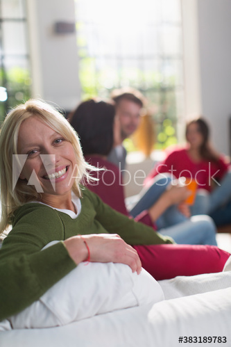 Portrait happy young woman on sofa