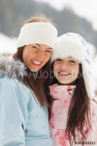 Portrait happy young women friends in warm clothing