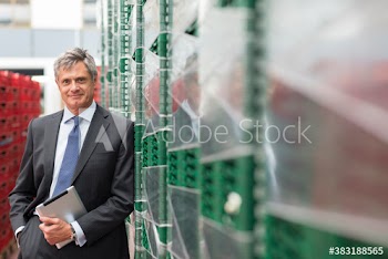 Portrait male manager with digital tablet in food processing plant