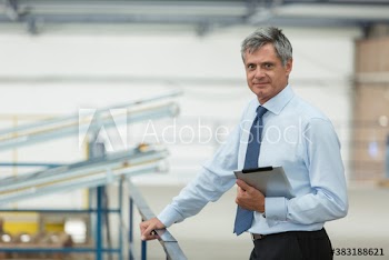 Portrait male manager with digital tablet in food processing plant