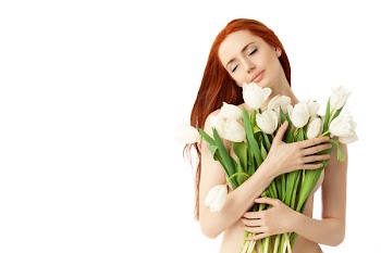 Portrait of a fresh and lovely woman with flowers