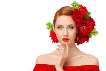 Portrait of a fresh and lovely woman with red flowers