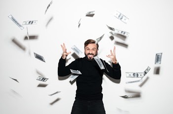 Portrait of a happy bearded man celebrating success Free Photo
