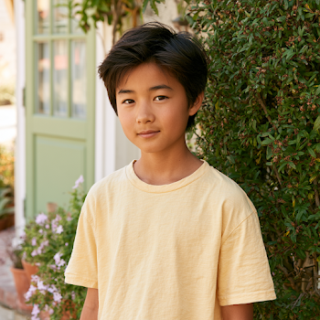 Portrait of a Twelve-Year-Old Asian Boy in a Yellow T-Shirt