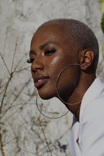 Portrait of a Woman Wearing Silver-colored Hoop Earrings