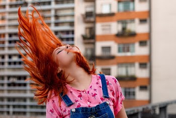 Portrait of a woman whipping her hair
