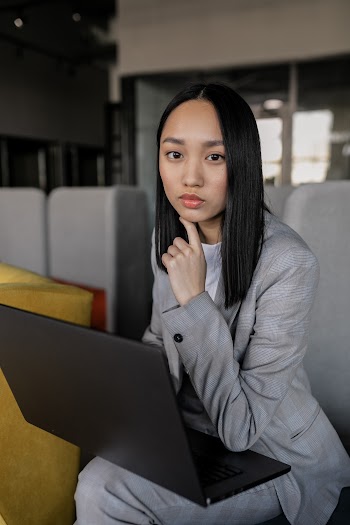 Portrait of a Woman with a Black Laptop · Free Stock Photo