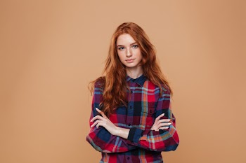 Portrait of a young pretty redhead girl Free Photo