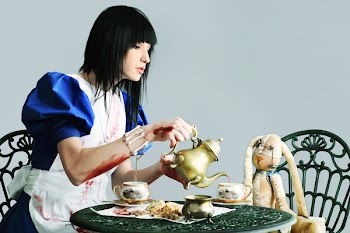 Portrait of a young woman dressed as Alice in Wonderland, video game.