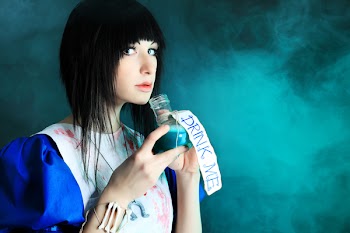 Portrait of a young woman dressed as Alice in Wonderland, video game.