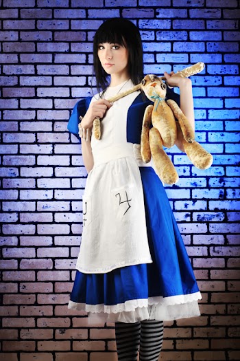 Portrait of a young woman dressed as Alice in Wonderland, video game.