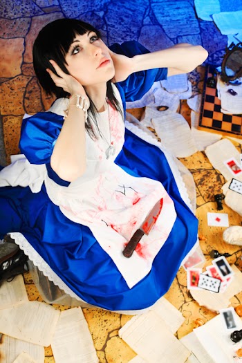 Portrait of a young woman dressed as Alice in Wonderland, video game.