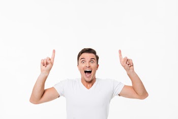 Portrait of an amused excited man in a white t-shirt Free Photo