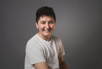 Portrait Of An Androgynous Person Smiling
