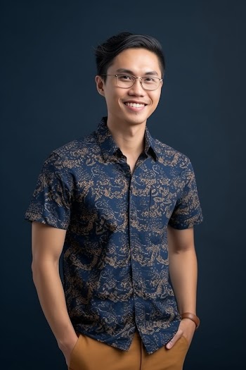 Portrait of an Asian young man wearing shirt, smiling generated by AI