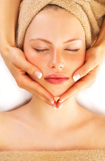 Portrait of Fresh and Beautiful brunette woman taking head massage
