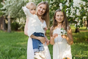 Portrait of happy young family, resting in a park