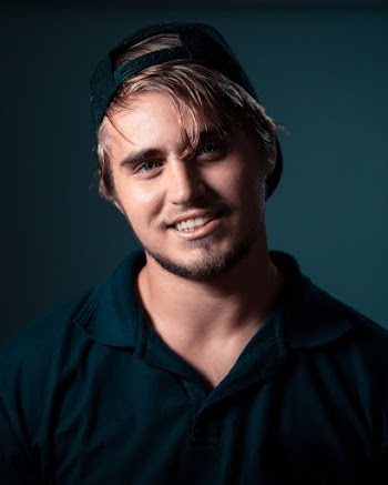 Portrait of Man Wearing Black Collared Top