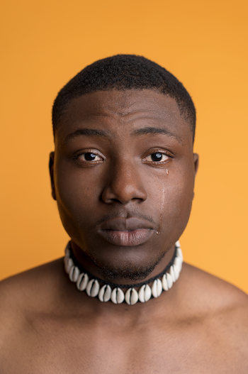 Portrait of Man Wearing Shell Choker Necklace