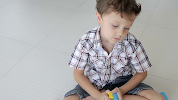 Portrait of sad little boy sitting on floor Stock Video Footage ...