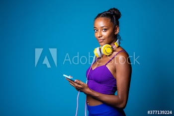 Portrait of smiling young woman using smartphone