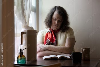 portrait of transgender woman sitting by window