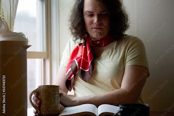 portrait of transgender woman sitting by window