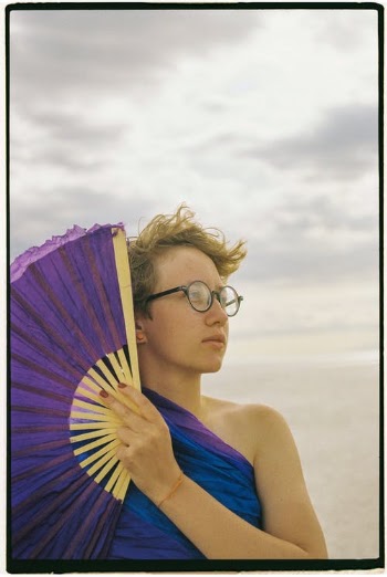 Portrait of Woman Holding Violet Range · Free Stock Photo