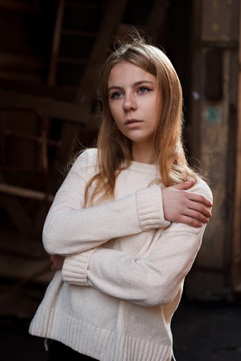 Portrait of Woman in White Sweater