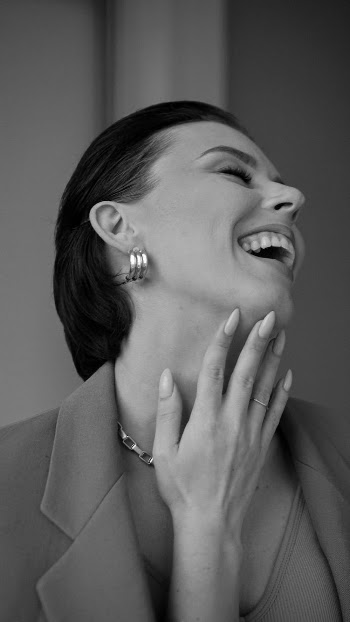 Portrait of Woman Laughing and Throwing Her Head Back 