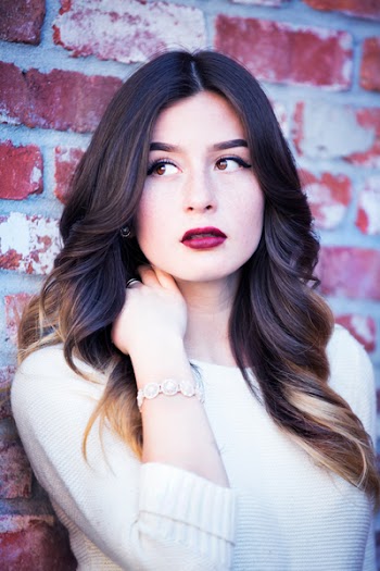 Portrait of Woman Leaning on Wall