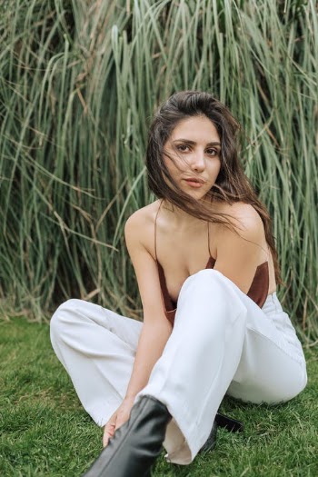 Portrait of Woman Sitting on Grass · Free Stock Photo